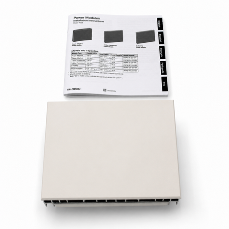 A beige rectangular electronic device, identified as the Single-Zone Dimming Interface Lutron Phase-Adaptive Power Module (Model PHPM-PA-120-WH), sits below a sheet of installation instructions for Lutron Power Modules, which includes diagrams and a chart of module characteristics for controlling LED dimmers and 120 V lighting loads.