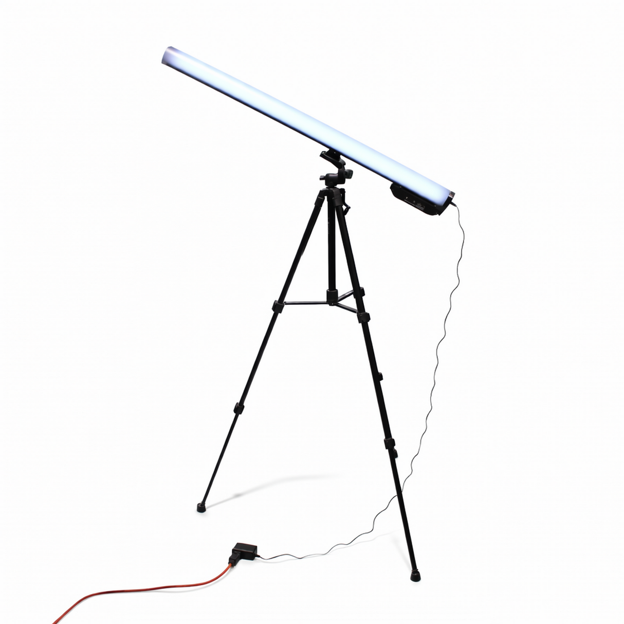 A Portable Long Range Casambi RGBW Tube Light is mounted diagonally on a black tripod stand, plugged in with a power cable and orange extension cord on the floor, creating an ideal wireless stage lighting setup against a white background.