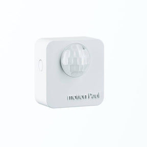 A white, square Battery Powered Motion Sensor for Casambi Lighting (Estol Motion Paul) with a rounded lens, designed for energy-saving automatic lighting control. Motion Paul is embossed below the lens and it’s mounted on a white background.
