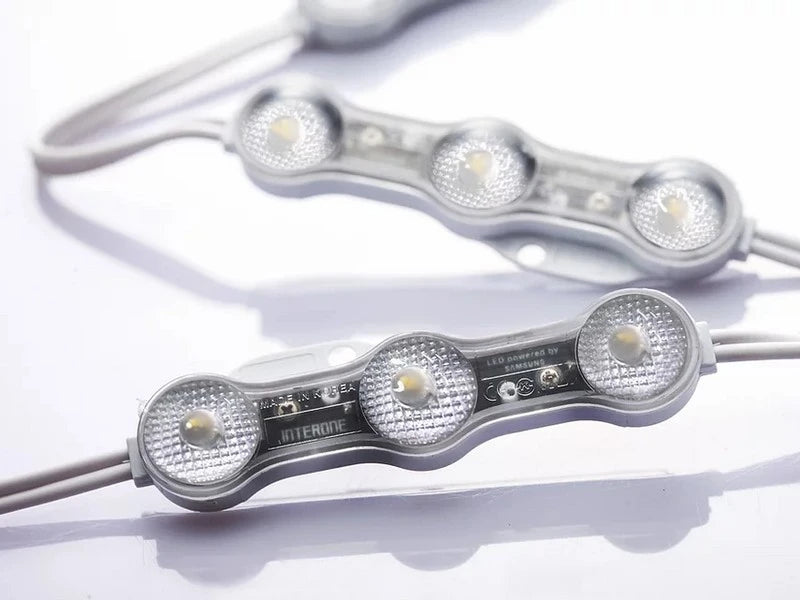 Close-up of two Samsung chip 3 LED modules (White Peanut Series, 12V) with IP68 waterproof rating, connected by wires. Each features three round LEDs with textured reflectors and a 180° lens on a white background.