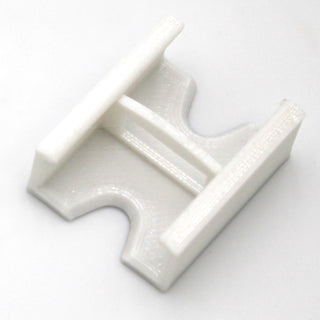 A Linear Connector for SL7 Profile, featuring a white plastic body with a rectangular center and two parallel prongs, is displayed on a plain white background.