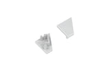 Two small, light gray, triangular plastic End Caps for the Corner10.v2 Profile—one oriented upward to reveal a smooth surface, the other inverted to display pegs and notches on the underside—sit against a white background. These components are designed specifically for use with the Corner10.v2 Profile lighting fixture, providing a clean and secure finish.