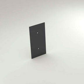 A dark, rectangular metal End Cap for New Washington Profile lighting, featuring two central vertical holes, is shown on a plain light surface.