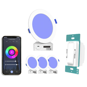 A smartphone shows a color control app beside three EnoLED 6 Ultra-Slim RGB+CCT Smart Wireless Downlights and Wall Switches, with blue-glowing lights and a wall-mounted smart dimmer for easy, seamless lighting kit control.