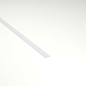 A long, thin LED Diffuser for Amsterdam Mini Profile lies diagonally on a plain, light background, with most of the strip positioned in the upper left portion of the image.