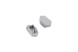 Two small, gray, plastic C End Caps for the Arc12 Duo Profile are displayed on a white background; one is positioned face up showing its prongs, while the other lies face down revealing a flat surface. These components serve as end caps for the Arc12 Duo Profile lighting fixture.