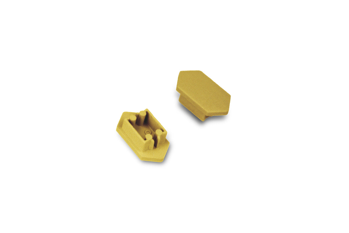 Two small, yellow, plastic C End Caps for the Arc12 Duo Profile lighting fixture are shown on a white background. One end cap stands upright, displaying its inner mechanism, while the other rests on its side to reveal a smooth, angled surface.