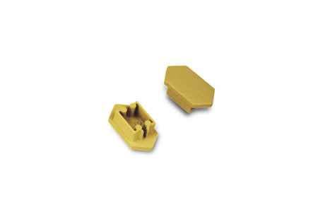 Two small, yellow, plastic C End Caps for the Arc12 Duo Profile lighting fixture are shown on a white background. One end cap stands upright, displaying its inner mechanism, while the other rests on its side to reveal a smooth, angled surface.
