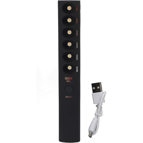 The Portable Color Temperature Lamp Stick is a black, handheld LED light with six color-labeled LEDs, an on/off button, adjustable color temperature, and a USB charging port. Ideal for photography fill light. Includes a short white USB cable.