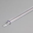 The LED Channel Cover ~ C Click Lens, made of clear plastic, is partially open to reveal the LED strip inside, placed on a plain gray surface.