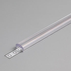The LED Channel Cover ~ C Click Lens, made of clear plastic, is partially open to reveal the LED strip inside, placed on a plain gray surface.