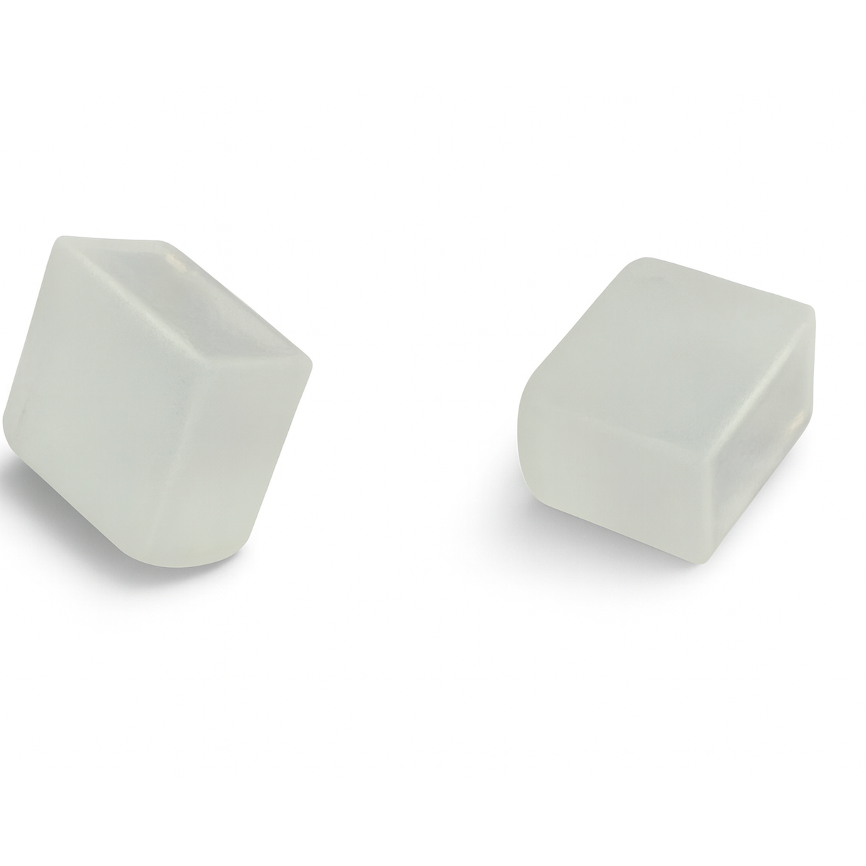Two translucent, rectangular silicone ice cubes with slightly rounded edges on a white background resemble the End Cap for Neon Flex Ultra Slim Series.