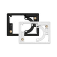Two rectangular plastic framePanelM wall mount frames for controlPanelM screens by BleBox, one black and one white, are shown overlapping. Each frame features circular and rectangular cutouts, screw holes, and small metal contact points on their surfaces.