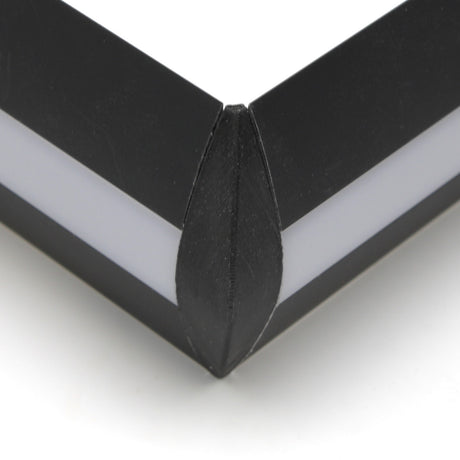Close-up of a black Alu-Flat profile frame with a white inner border, highlighting the seamless edges joined by the Plastic Corner Connector for Alu-Flat Profile with integrated 3D printed plastic construction.