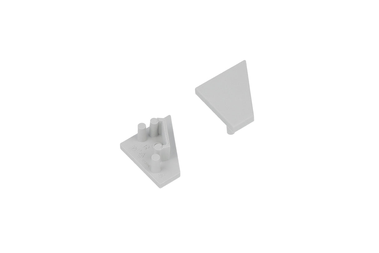Two light gray triangular End Caps for the Corner10.v2 Profile lighting fixture are arranged on a white background—one positioned with its smooth surface facing up, and the other flipped over to display its connectors and studs.