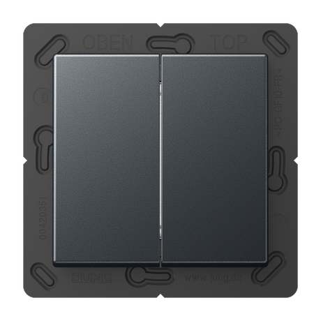 The Casambi 4-Channel Wireless Radio Transmitter (Jung BLE A 595) is a dark grey double light switch on a black frame, marked OBEN and TOP at the top and www.jung.de at the bottom, featuring Bluetooth Low Energy.