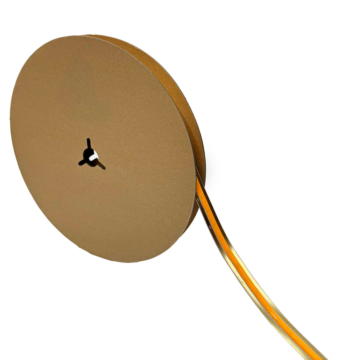 A cardboard spool holds a partially unwound, clear strip of COB IP20 High CRI LED Strip (24V) ~ Elite Gold Series in orange, extending out for seamless, dot-free lighting.