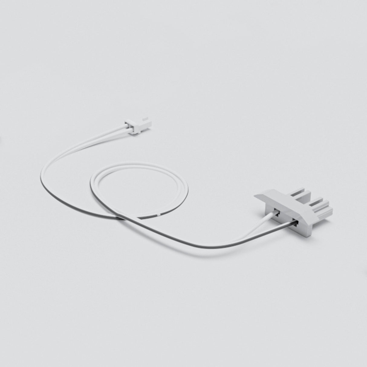 The Cut & Connect End Cap for Frankfurt Profile—a white, minimalist cable with a small connector on one end and a block-shaped, multi-pronged end cap on the other—rests coiled on a plain light gray background, perfect for linear lighting systems.