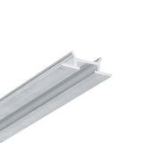 A close-up view of the Complementary Profile ~ Model Pixy20-03, a silver metal T-bar or T-shaped ceiling grid component, set against a white background. Featuring a narrow horizontal top and a central vertical support, this aluminum profile is ideal for integrating architectural lighting fixtures.