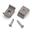 Two gray Surface Mounts for Yukon Profile and two silver screws are shown on a white background. These 3D printed plastic brackets from Wired4Signs USA are used as mounting accessories for the Yukon LED profile.
