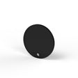 A black, flat, circular Plastic End Cap for Sierra65 Profile stands upright on a white surface with a small hole near its bottom edge, showcasing its minimalist design.