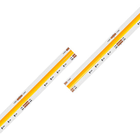 Two Tunable White COB IP20 High CRI LED Strips (24V) from the UniCCT Series, featuring yellow diodes and visible circuit elements, are arranged diagonally and parallel on a white background. These strips provide precision illumination with high color rendering, making them ideal for environments where color accuracy is essential.