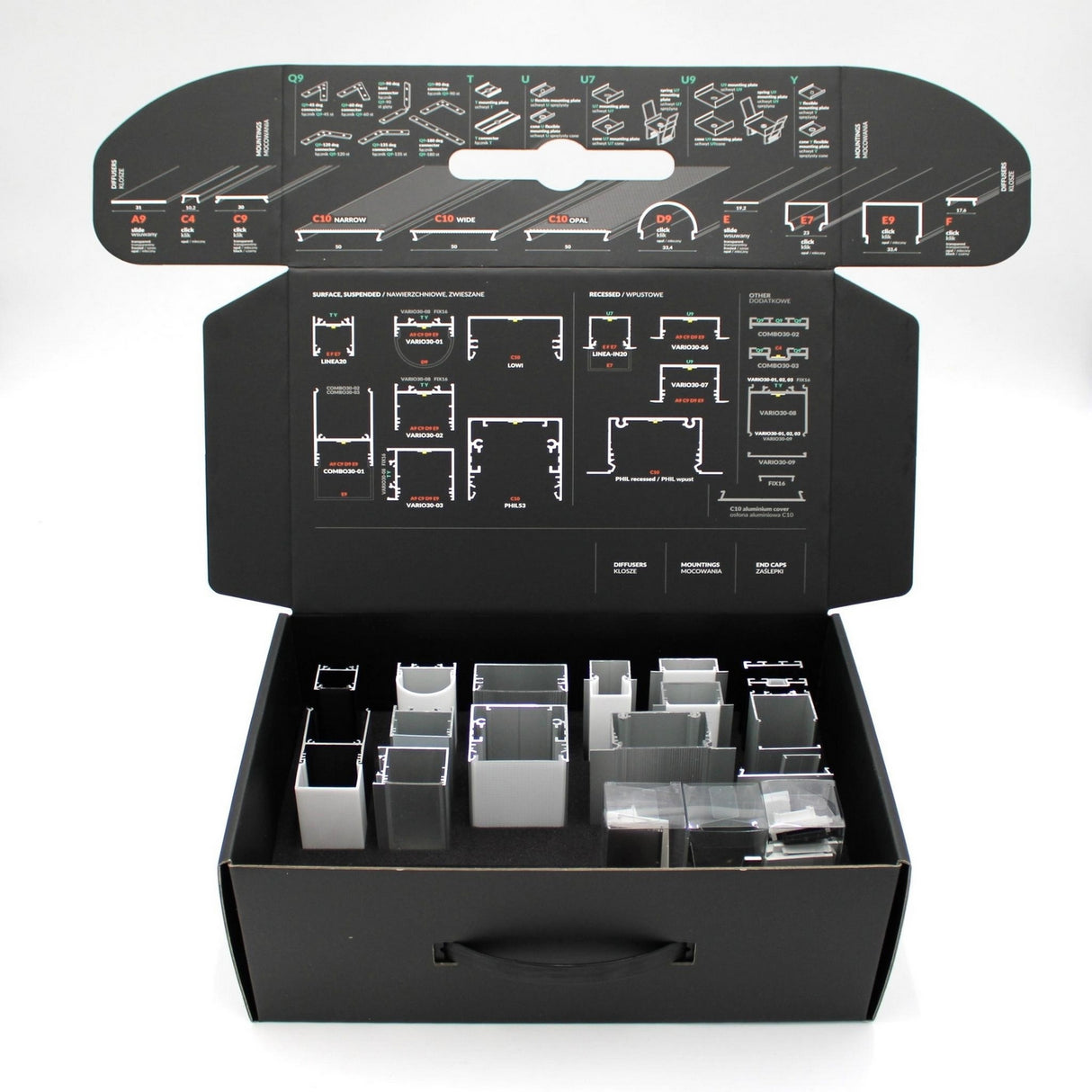 The Topmet LED Channel Sample Case is a black box with assorted metal and plastic channel profiles, including aluminum and lighting samples in compartments and zip bags. The lid features detailed assembly diagrams and identification instructions.