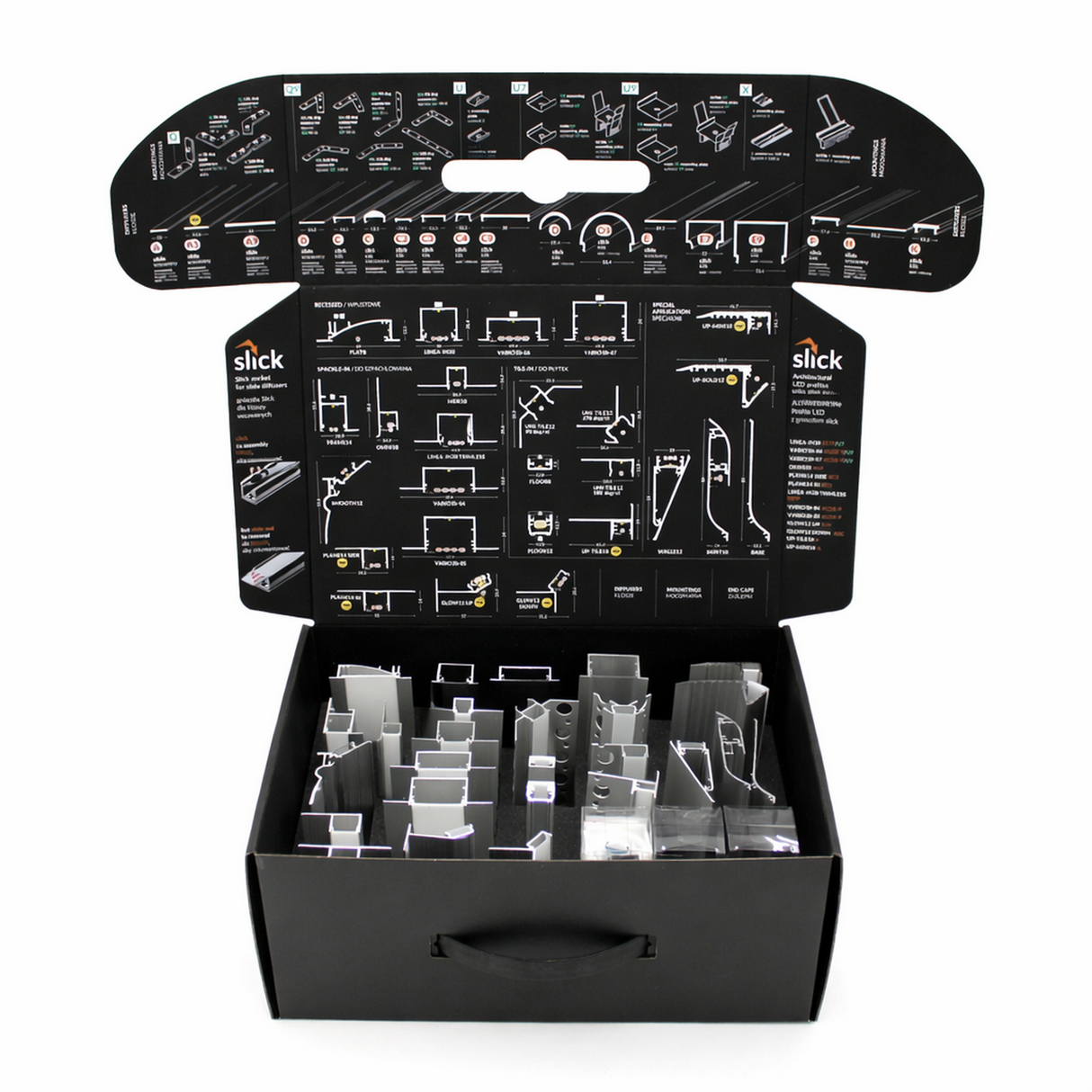 The Topmet LED Channel Sample Case is an open black box with assorted aluminum profile samples for architectural models, plus detailed assembly instructions and diagrams printed on the inside flaps of the lid.