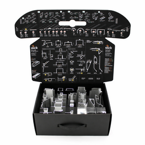 The Topmet LED Channel Sample Case is an open black box with assorted aluminum profile samples for architectural models, plus detailed assembly instructions and diagrams printed on the inside flaps of the lid.