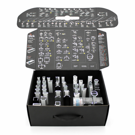 The Topmet LED Channel Sample Case is a black box with a handle, featuring organized slots displaying various architectural and aluminum profile samples, and detailed diagrams printed inside the lid for a professional product presentation.
