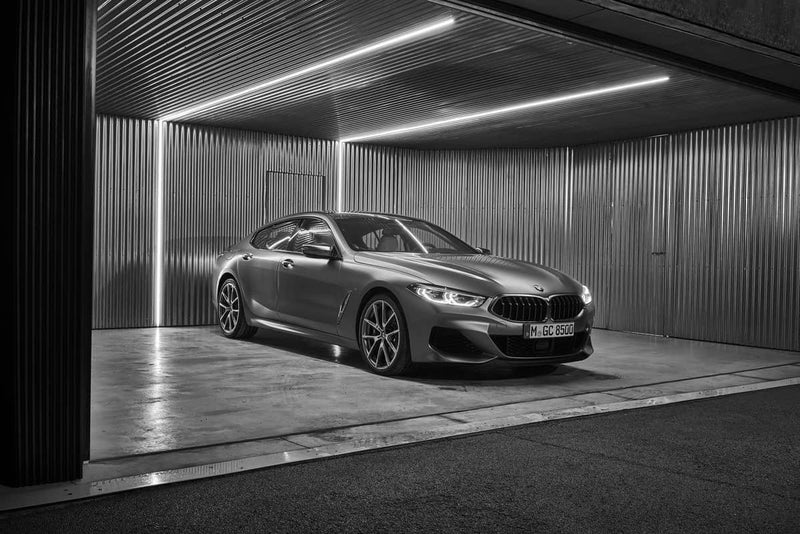 Automotive garage lit with recessed linear LED lighting and high-performance LED heat sinks for precise light diffusion