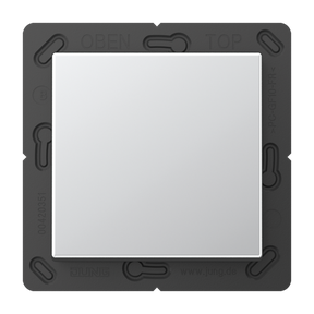 A square, silver Casambi 1-Button Wireless Wall Switch (Model Jung BLE A 590) is mounted on a black plastic frame with visible markings and slots around the edges.