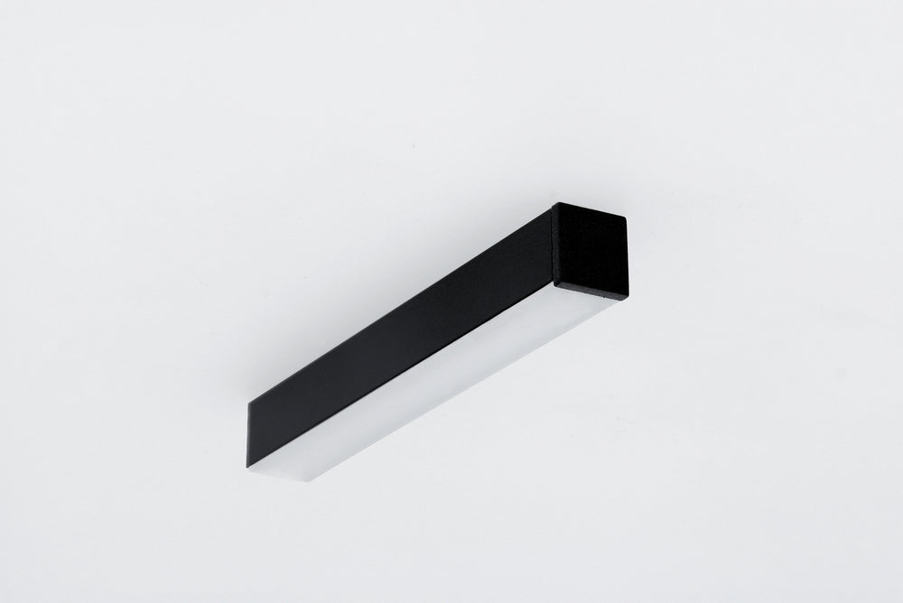 Black rectangular 0.51″ Suspended/Surface Mount Bendable LED Channel ~ Model Bend8 with a frosted diffuser panel mounted on a white surface.