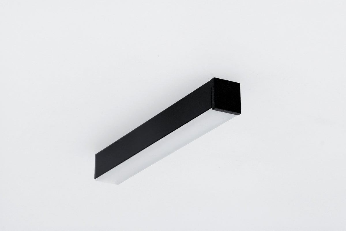 Black rectangular 0.51″ Suspended/Surface Mount Bendable LED Channel ~ Model Bend8 with a frosted diffuser panel mounted on a white surface.