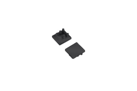 Two small black ABS End Cap for Bend8 Profile pieces, one shown from the top and the other from the underside with mounting pegs.