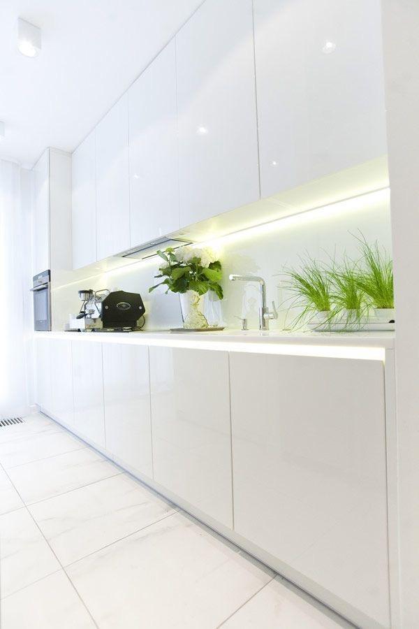 Bright LED strips used under kitchen cabinets to create modern ambiance.