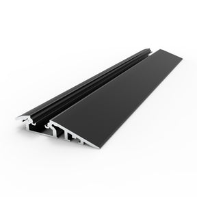 The Floor Transition Strip LED Channel ~ Model Broadway is a black and silver metal ramp with a ridged surface, engineered as a treadable threshold for smooth movement between floor levels. It is displayed against a white background.