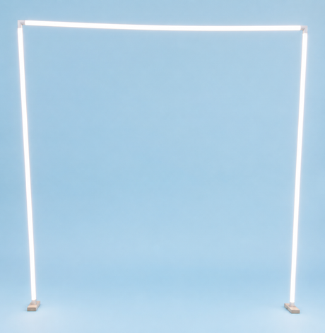Glowing white Sierra38 LED diffuser tubes form a rectangle on light blue, with each corner anchored by a Structural PVC Joiner for Sierra38 Tube Profile, creating an inventive lighting design.