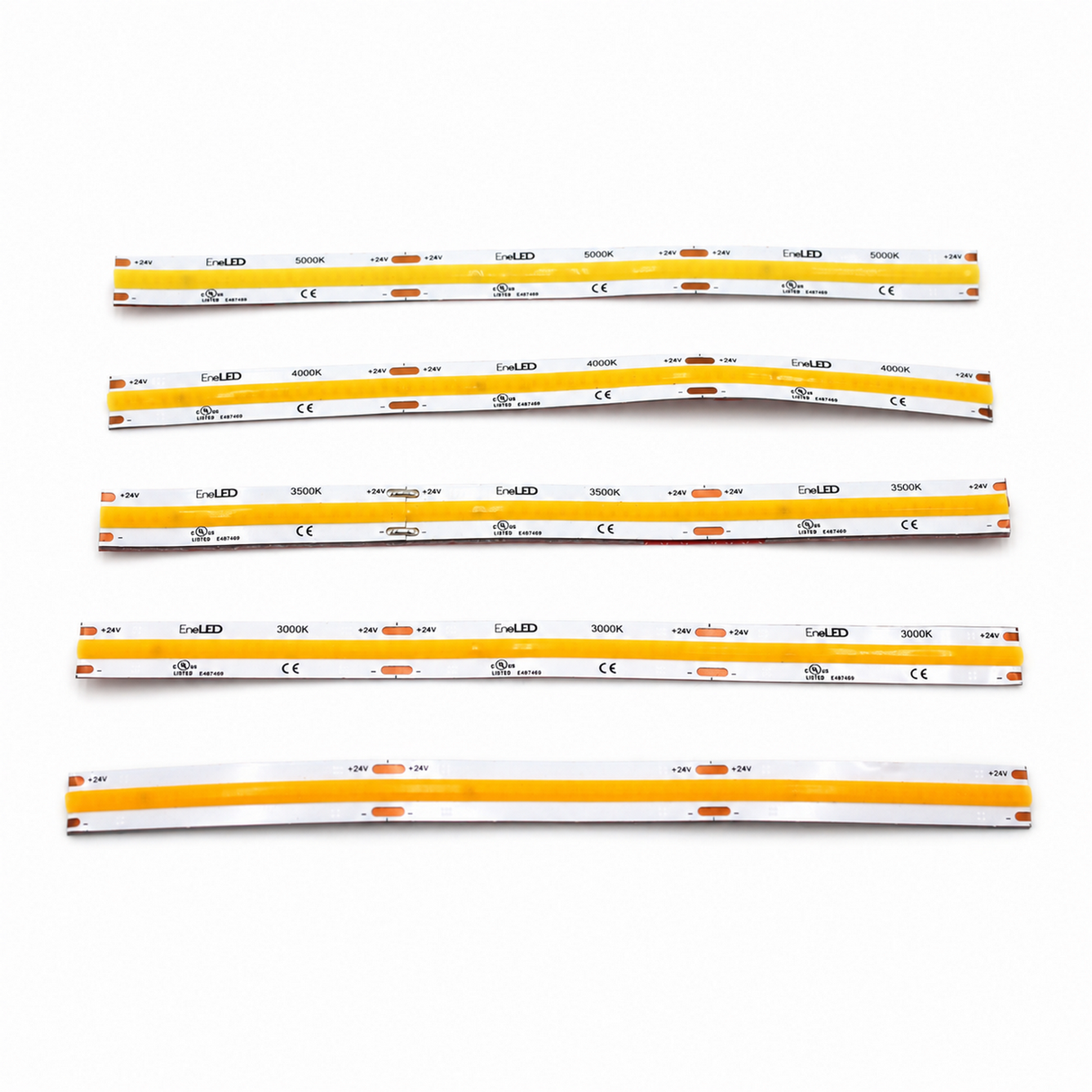 Six yellow and white flexible COB IP20 Dotless LED Strip (24V) ~ UniBasic Series light strips are laid out on a white surface, each labeled with technical specifications and featuring small orange sections evenly spaced along their lengths. Incorporating advanced 24V dotless LED strip technology, these high CRI LED strips provide smooth, consistent illumination that’s ideal for precise lighting applications.