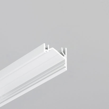 A close-up of the Surface Mount Corner LED Channel, Model Corner12.v2— a white, rectangular aluminum profile with grooves, shown on a gray background—perfect for modern under cabinet lighting solutions.
