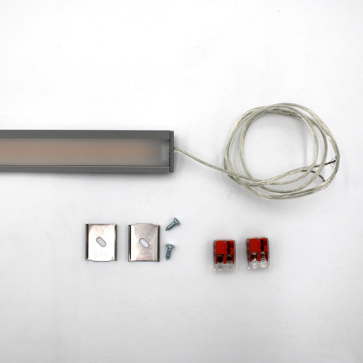 White Universal Surface-mount LED Corner Lighting Fixture (24V) ~ Corner14 Series shown with clear wire, metal mounting brackets, screws, and red wire connectors—perfect as an under cabinet lighting surface mount fixture.