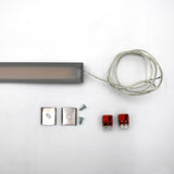 White Universal Surface-mount LED Corner Lighting Fixture (24V) ~ Corner14 Series shown with clear wire, metal mounting brackets, screws, and red wire connectors—perfect as an under cabinet lighting surface mount fixture.