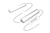Diagram shows two White Universal Surface-mount LED Corner Lighting Fixtures (24V) ~ Corner14 Series connected by wires for corner or under-cabinet use. A note says “24V PSU required (not included)” with a wire leading to a 110V outlet.