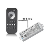 The EnoLED ES-RT-Z4-DIM Single Color Dimming Touch Wheel RF Remote Controller, shown in black with numbered buttons and a circular touchpad beside a white LED controller, provides wireless LED lighting control via 2.4GHz RF.
