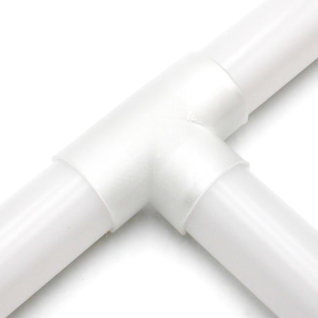Close-up of a Drop Ceiling Join Cover for 1.5" Round Profiles connecting three white pipes with a T-shaped joint, shown on a white background.