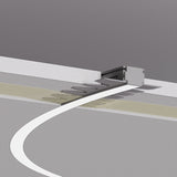 A white line on a gray floor curves toward a small wall opening, passing textured surfaces and tactile paving, echoing the fluid design of the 0.8 Bendable Drywall LED Lighting Channel ~ Model Klus KOZMA-BD found in modern interiors.