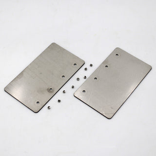 Two Aluminum Straight Joints for Munich Magnum with holes are side by side on a white surface. Several small metal balls are scattered around them, resembling parts from the assembly set.