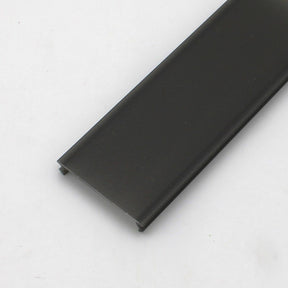 A close-up of the Black Diffuser for PL55, DPL55, RPL55, and PL55-FL Profile shows its flat, rectangular form with grooved edges for optimal light dispersion, set against a plain white background.