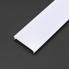A flat, rectangular white plastic diffuser cover with a satin opal finish for PL55, PL55-FL, DPL55, RPL55, and RPL55 US series rests on a dark surface.