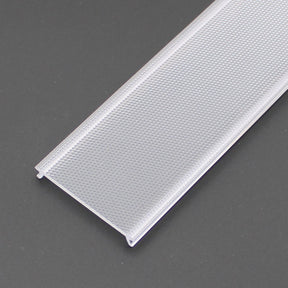 A close-up of the prismatic honey comb effect antiglare diffuser for PL55, DPL55, RPL55 LED profiles—rectangular and transparent with a textured, dotted surface and small flanges on each long edge—shown against a dark background.